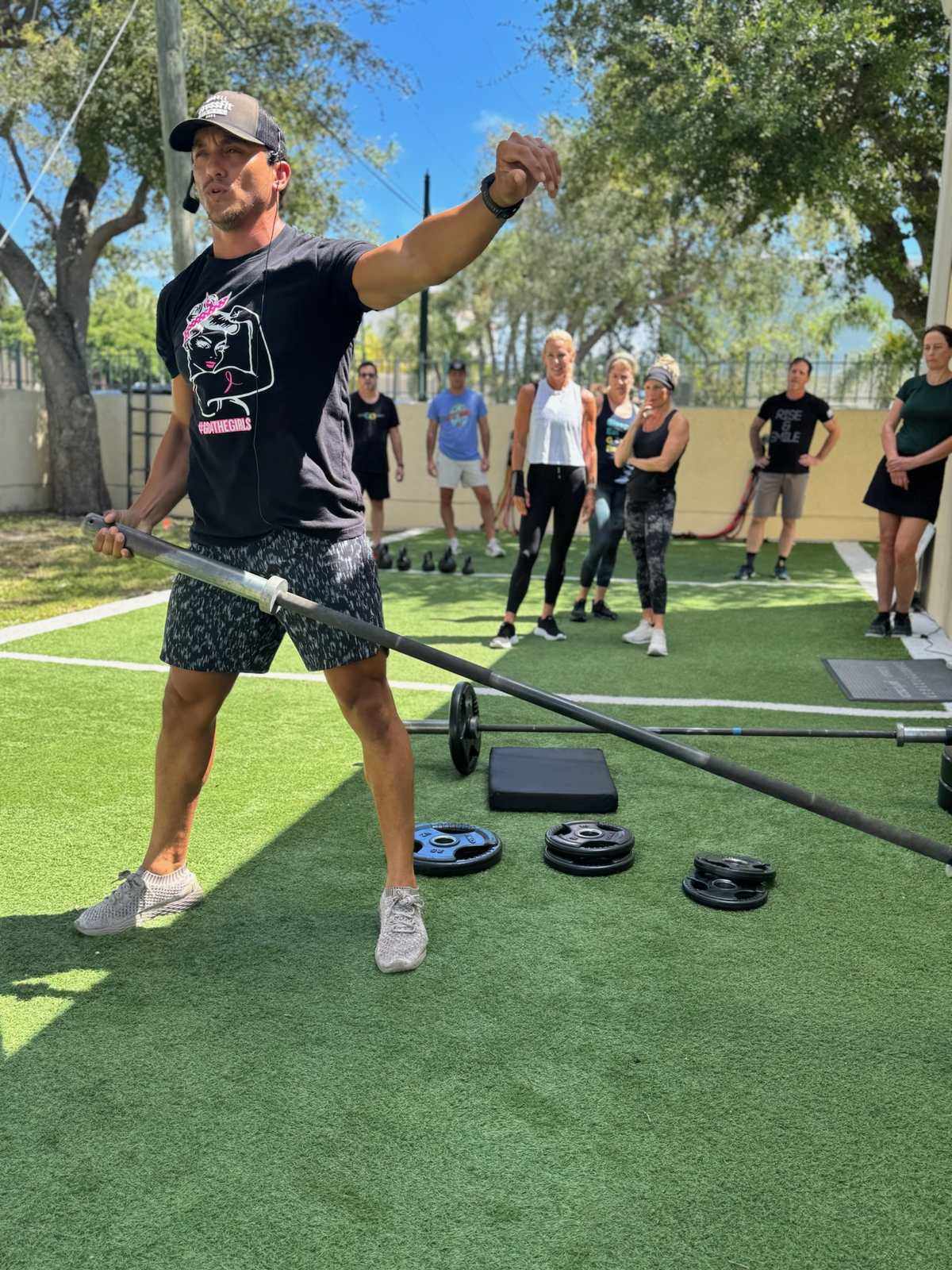 A coach leading an outdoor group class