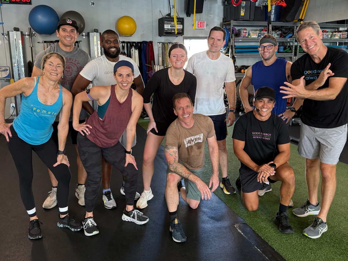 The Gravity + Oxygen crew smiling together inside the gym